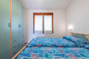 Ένα ή περισσότερα κρεβάτια σε δωμάτιο στο Casa Vacanze dei Pini