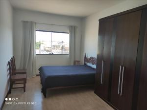 Postel nebo postele na pokoji v ubytování Excelente suíte próximo ao centro