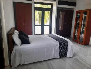 Ένα ή περισσότερα κρεβάτια σε δωμάτιο στο Sun-Era Villa