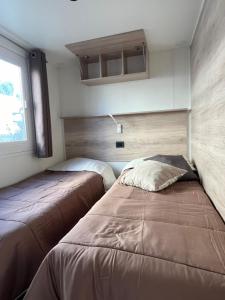 A bed or beds in a room at Camping Adriatico