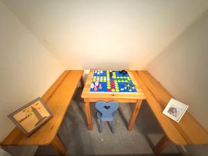 a wooden table with a lego table with a toy on it at Pastoratshof Whg 4 in Wrixum +10 photos