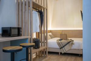 Postel nebo postele na pokoji v ubytování Nomad Haux Mestalla Room 101