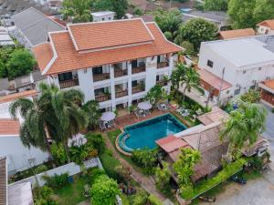 an aerial view of a house with a swimming pool at Monaburi Boutique Resort in Rawai Beach