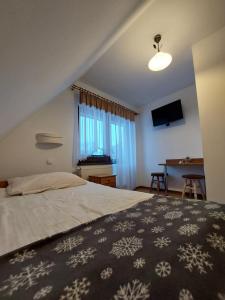 Postel nebo postele na pokoji v ubytování D.W. Harnaś