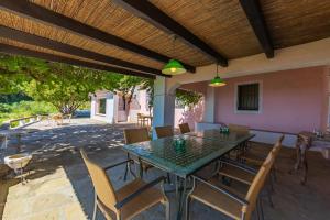 a patio with a table and chairs on a patio at Cortijo Cantarranas - Tarifa in Tarifa