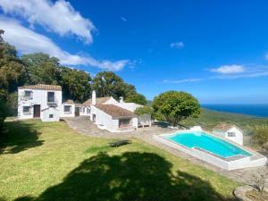 an aerial view of a house and a swimming pool at Cortijo Cantarranas - Tarifa in Tarifa
