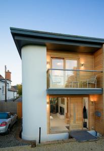 a house with a large window on the side of it at 3 Bedroom Eco house in Chichester near Goodwood in Chichester