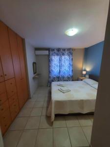 A bed or beds in a room at Sior Dionysios Apartments