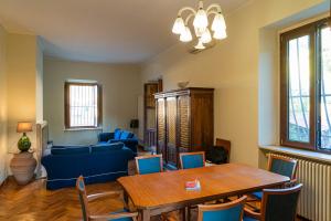 a living room with a table and a blue couch at Relax on the Sea in Pizzo +21 photos