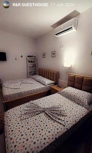 Letto o letti in una camera di R&R GESTHOUSE