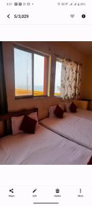 The Muthu Beach Resort客房内的一张或多张床位