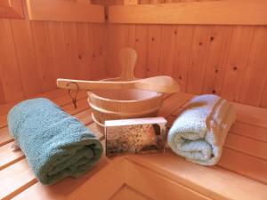 a sauna with two towels and a tub at Villa Pura Vida in Oud-Ade +73 photos