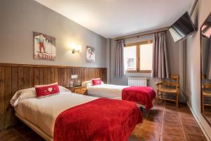 Postel nebo postele na pokoji v ubytování Hotel Snö Beret