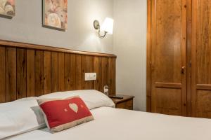 Postel nebo postele na pokoji v ubytování Hotel Snö Beret