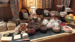 a counter with jars and other items on a table at Thalerhof in Roppen