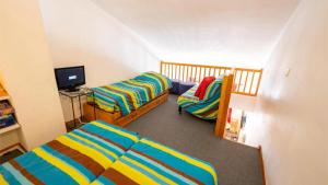 Ένα ή περισσότερα κρεβάτια σε δωμάτιο στο Le Thabor