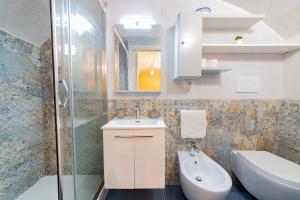 a bathroom with a sink and a toilet and a shower at Holiday Home San Lazzaro in Lecce +17 photos