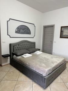 Postel nebo postele na pokoji v ubytování L'oasi del Tuffatore