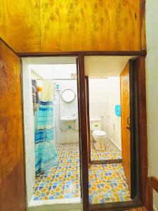 a bathroom with a toilet in a room at Aloha LuangPrabang Hostel Capsule in Luang Prabang +13 photos