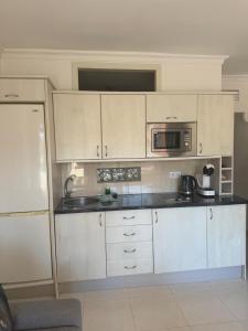 Kuchyň nebo kuchyňský kout v ubytování Palmeras Suite Fuengirola