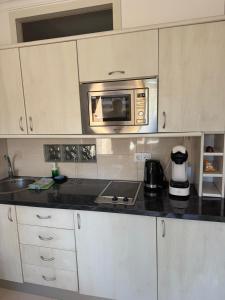 Kuchyň nebo kuchyňský kout v ubytování Palmeras Suite Fuengirola
