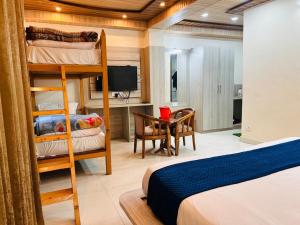 Postelja oz. postelje v sobi nastanitve Yog Maya Regency B&B