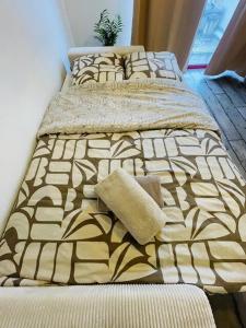 a pair of beds in a bedroom with at Le Studio de Théa - Private Parking - 2 Guests in Le Mans