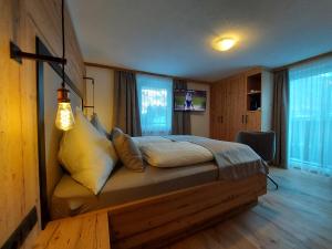 Postel nebo postele na pokoji v ubytování Hotel Gasthof Walcher