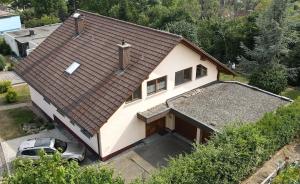 a house with a car parked in front of it at Apartment DS - Rebberg in Donaueschingen