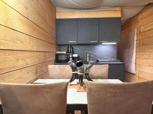 a dining room with a table and chairs at Le Viking in Besançon +7 photos