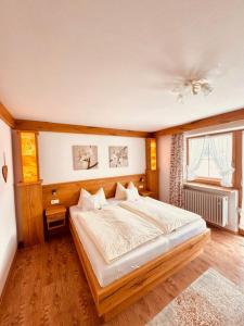 Postel nebo postele na pokoji v ubytování Gästehaus Marchler