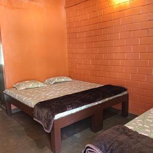 Giường trong phòng chung tại Banakal Hosmane Homestay