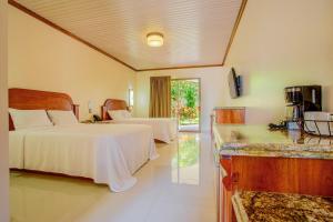 Ένα ή περισσότερα κρεβάτια σε δωμάτιο στο Los Lagos Spa & Thermal Resort Experience