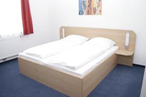 Postel nebo postele na pokoji v ubytování G&K Hotel