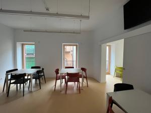a dining room with tables and chairs in a building at Alberg Os de Balaguer in Os de Balaguer