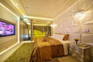 Katil atau katil-katil dalam bilik di Chusha Motel