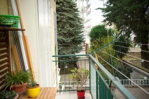 a balcony with potted plants on the side of a building at Giaco Symphony Stay in Bari