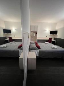 Postel nebo postele na pokoji v ubytování Damodoro Hotel