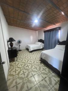 Ένα ή περισσότερα κρεβάτια σε δωμάτιο στο Departamento suite # 1