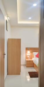 Postel nebo postele na pokoji v ubytování Sree Nandhanam apartment's