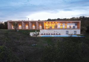 a large house with a pool in front of it at ViilA Cheia in Cheia +29 photos