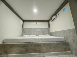Postel nebo postele na pokoji v ubytování Resolve Garden Hotel