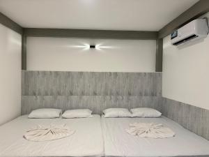 Postel nebo postele na pokoji v ubytování Resolve Garden Hotel