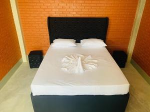 Postel nebo postele na pokoji v ubytování Resolve Garden Hotel