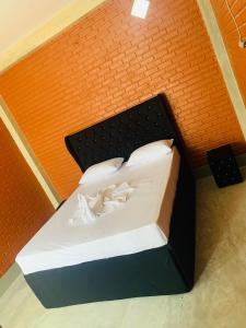 Postel nebo postele na pokoji v ubytování Resolve Garden Hotel
