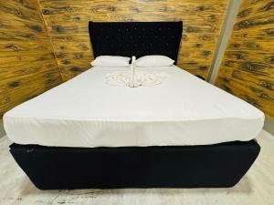 Postel nebo postele na pokoji v ubytování Resolve Garden Hotel