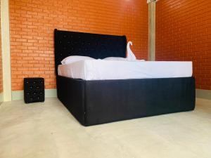 Postel nebo postele na pokoji v ubytování Resolve Garden Hotel