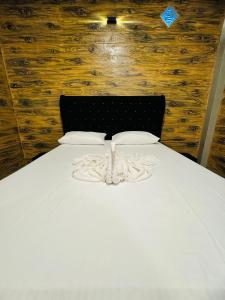 Postel nebo postele na pokoji v ubytování Resolve Garden Hotel