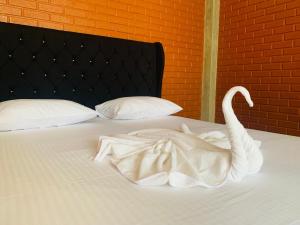 Postel nebo postele na pokoji v ubytování Resolve Garden Hotel