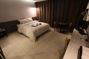 Postel nebo postele na pokoji v ubytování Hotel Cacao